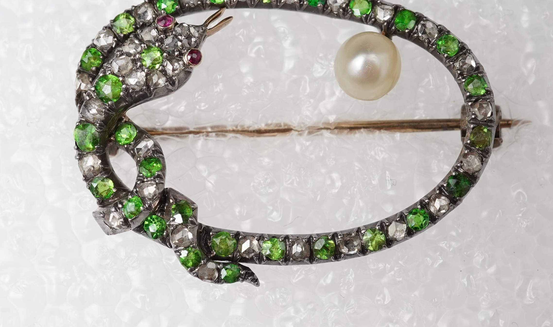 A Victorian demantoid garnet, pearl and diamond brooch, late 19th century